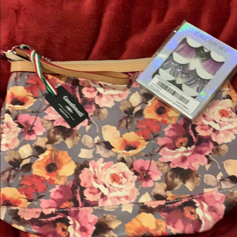 Leather wristlet with eyelashes bonus all new